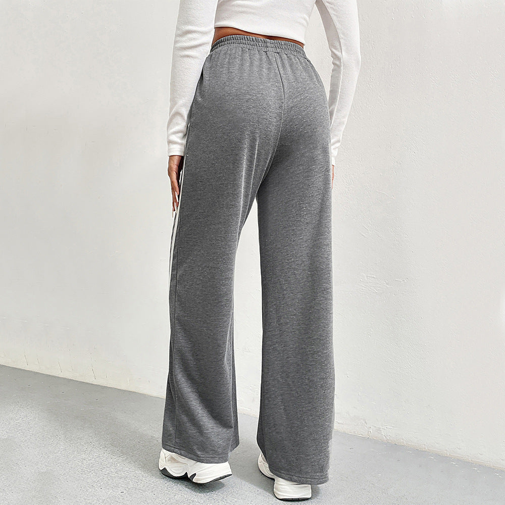 Pantalons de loisirs sportifs pour femmes avec coupe large et rayures contrastées Chic & Stil