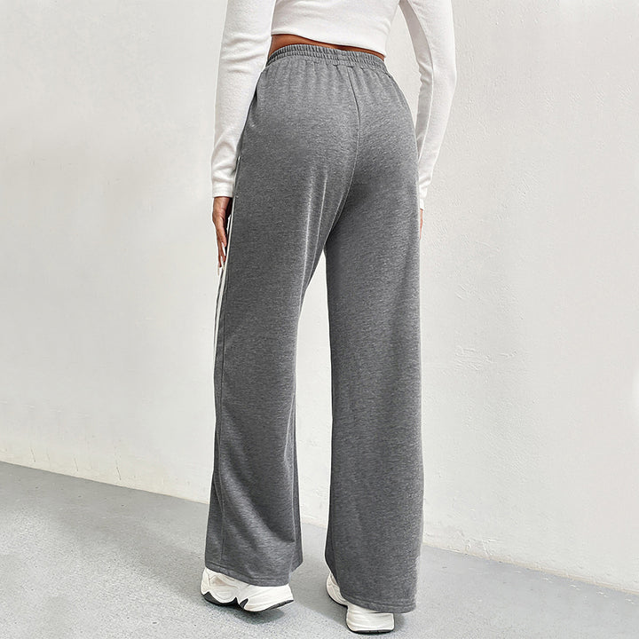 Pantalons de loisirs sportifs pour femmes avec coupe large et rayures contrastées Chic & Stil