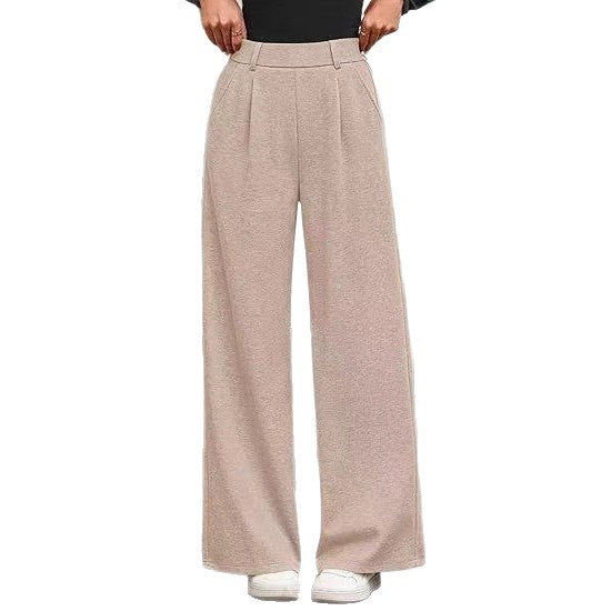 Loose fabric trousers for women with high waist and practical pockets. Chic and style
