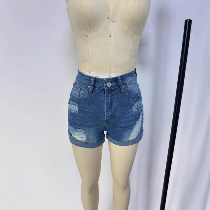 Women's short destroyed denim shorts in a casual look with rolled hems and stylish ripped details Lune London