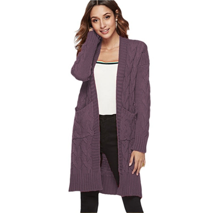 Chunky knit cardigan for women with an elegant cable design and practical pockets Lune London
