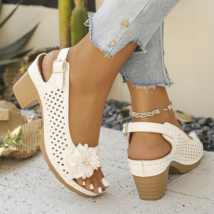 Women's clogs with a decorative floral detail and a perforated surface Lune London