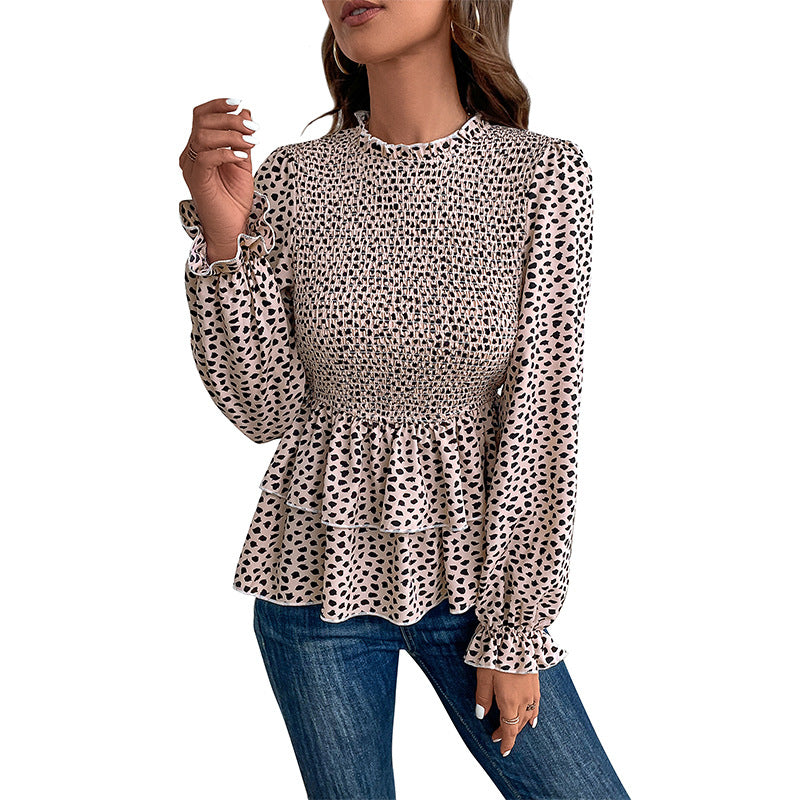 Women’s blouse with extravagant gathered details and a chic polka dot pattern