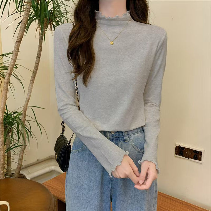 Chemise à manches longues pour femme avec col montant sophistiqué et volants