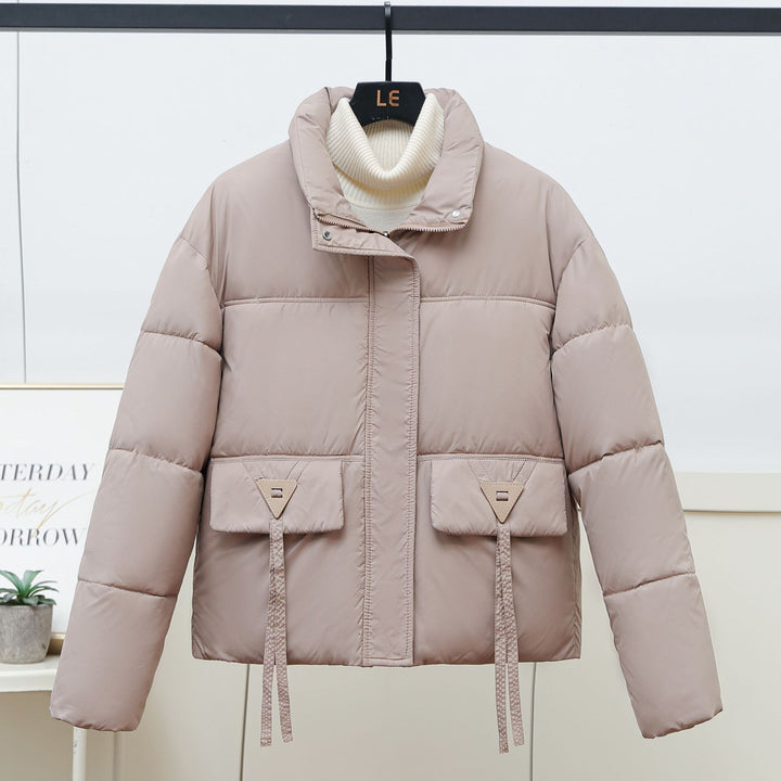 Quilted transitional jacket for women with high collar and practical modern pockets Lune London