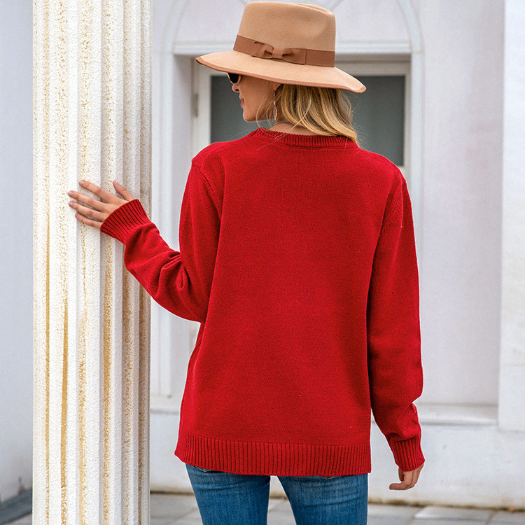 Knitted sweater for ladies with festive reindeer pattern and gold buttons Lune London