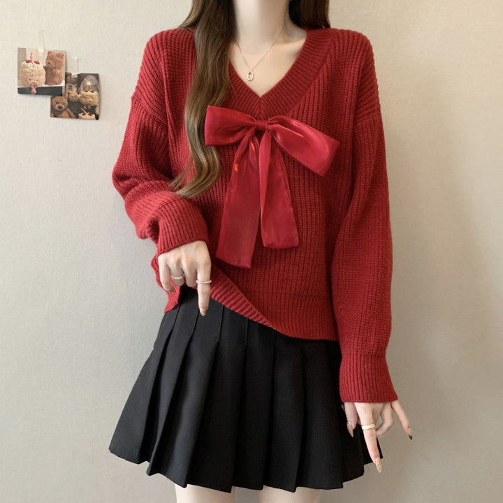 Knitted sweater for women with V-neck and decorative bow accent Lune London