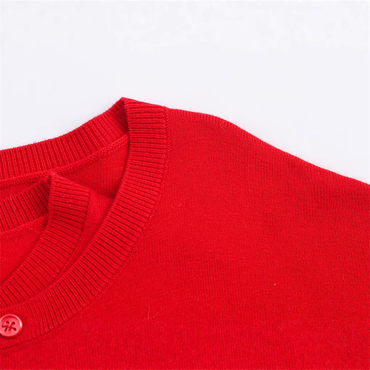 Short knitted sweater for women with button detail and V-neck Lune London