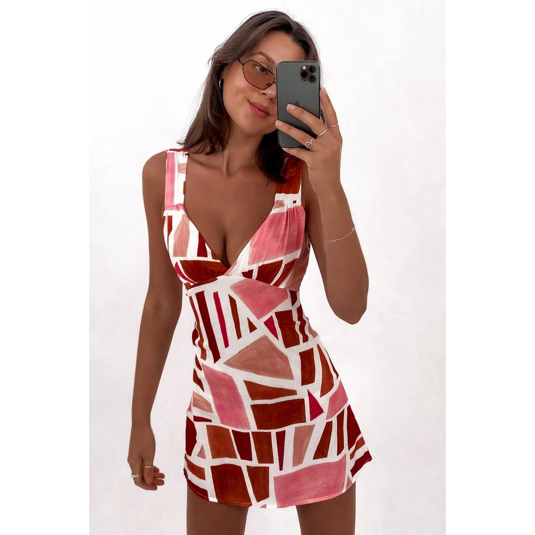 Women’s mini dress with elegant wrap design and playful wave cut