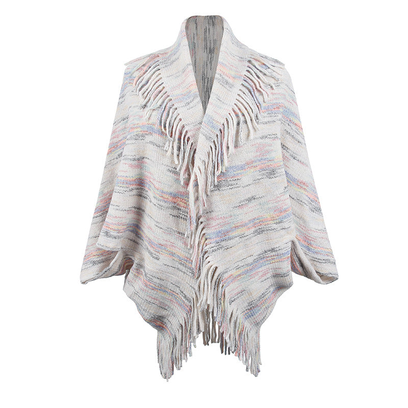 Ladies knitted poncho with luxurious fringes and a modern design Lune London