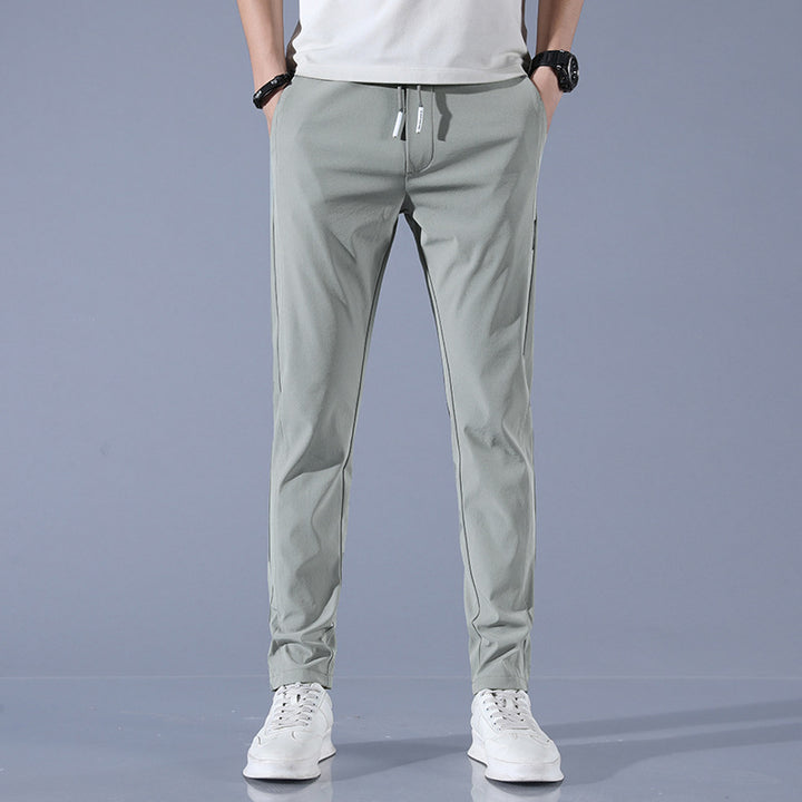 Sports jogger pants for men with elastic waist and practical zip pockets Lune London