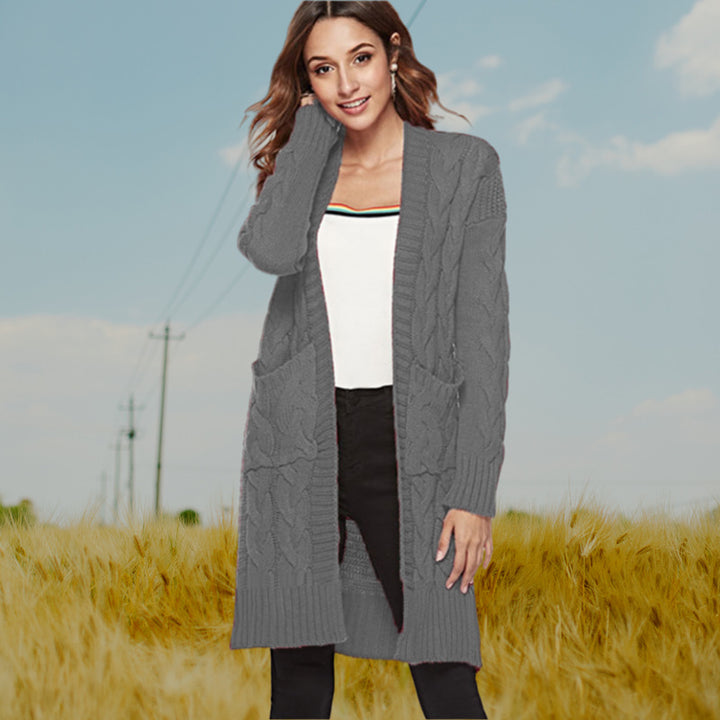 Chunky knit cardigan for women with an elegant cable design and practical pockets Lune London