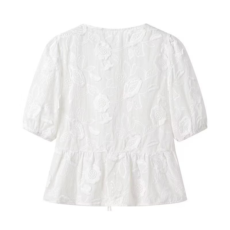 Women's blouse with embroidered floral pattern and romantic ruffle details Lune London