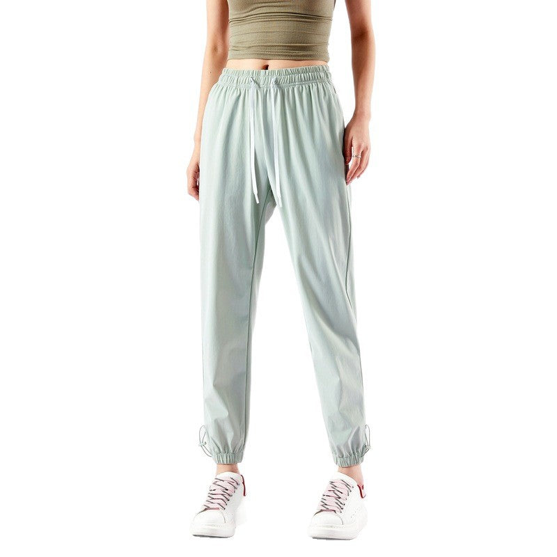 Light sport pants for women with elastic waist and practical pockets Lune London