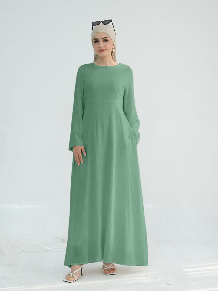 Elegant maxi dress for women with long sleeves and side pockets Lune London