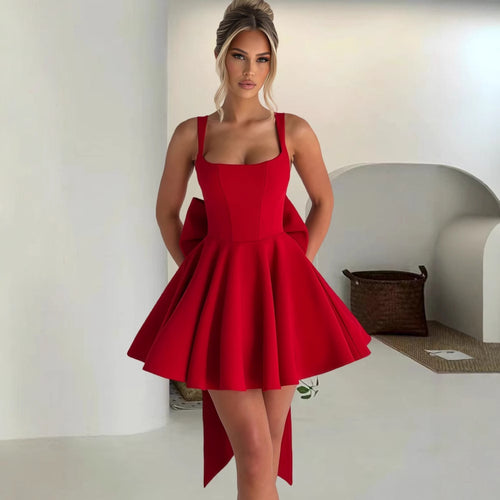 Women's cocktail dress with oversized bow design and flowing skirt Lune London