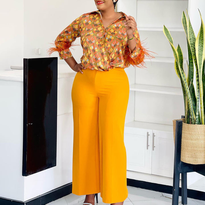 Expressive outfit for women with printed blouse and wide pants Lune London