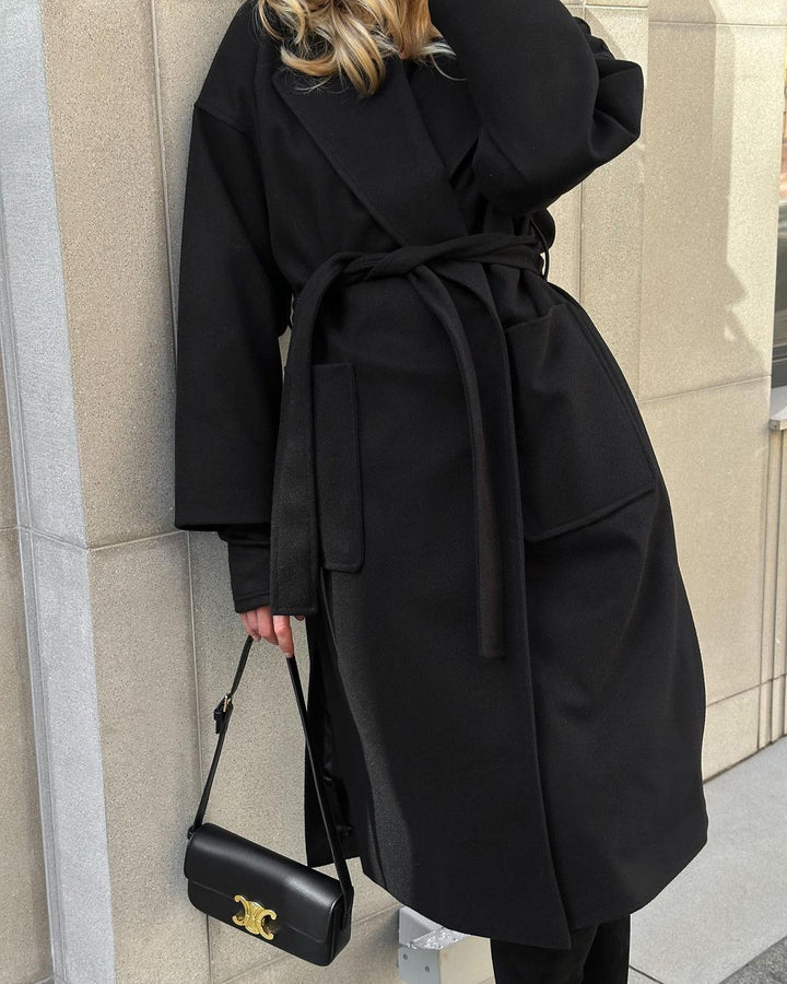 Elegant transitional coat for women with wide lapels and belt detail Lune London