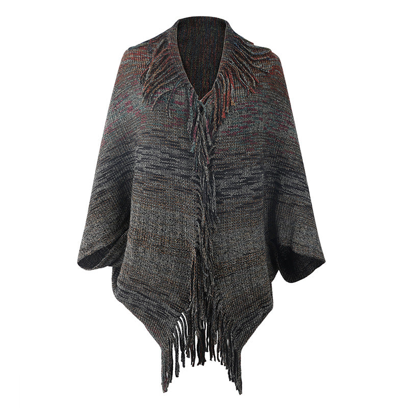 Trendy women's poncho with fringed hem and structured design Lune London