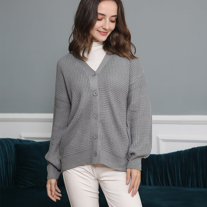 Women's knitted jacket with structured pattern and practical button details Lune London