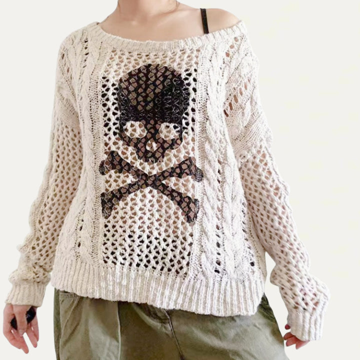 Oversized knit sweater for women with a creative hole pattern and a chic anchor design