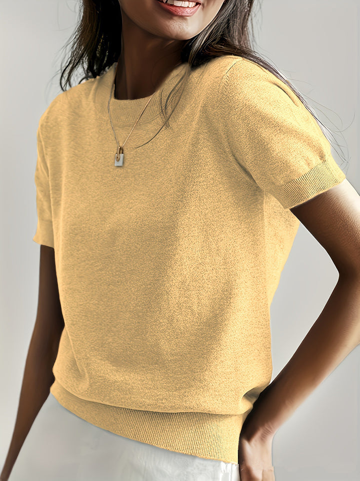 Fine knit sweater for women with a short sleeve silhouette and a soft fluid material Elegance and style