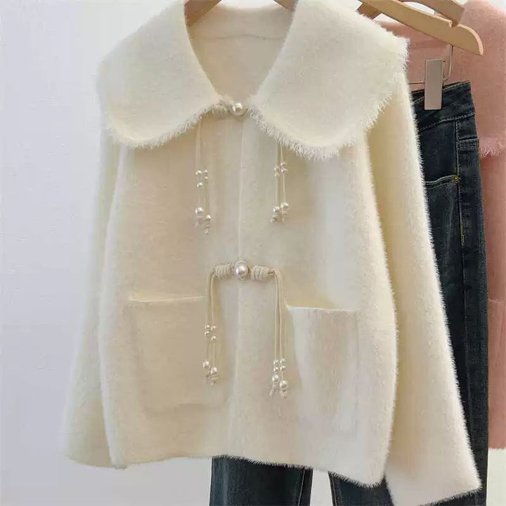 Cardigan féminin élégant avec détails en perles Chic & Stil