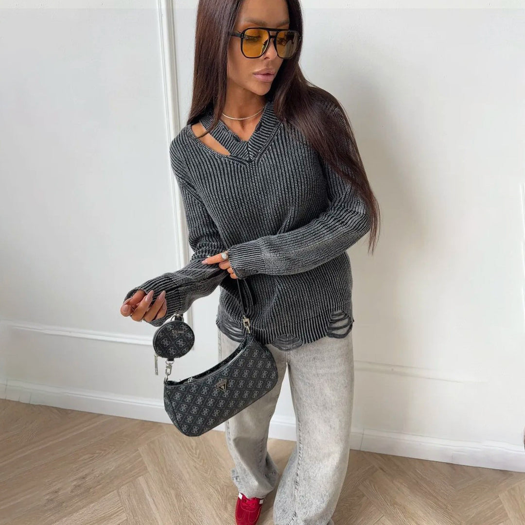 Thick knitted sweater for women with a trendy V-neck and worn elements Lune London