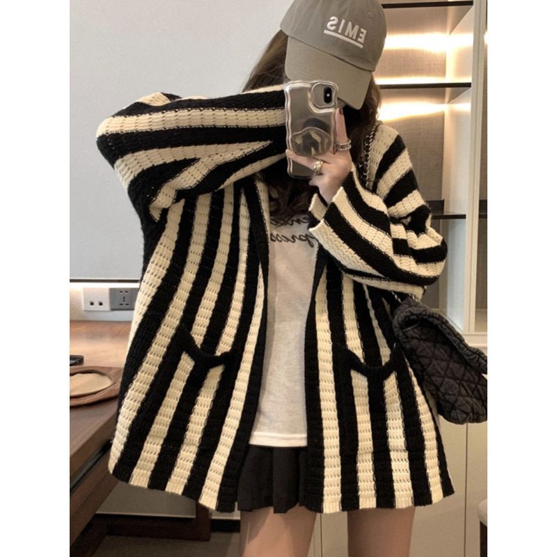 Ladies oversized knit poncho with graphic stripe pattern Lune London