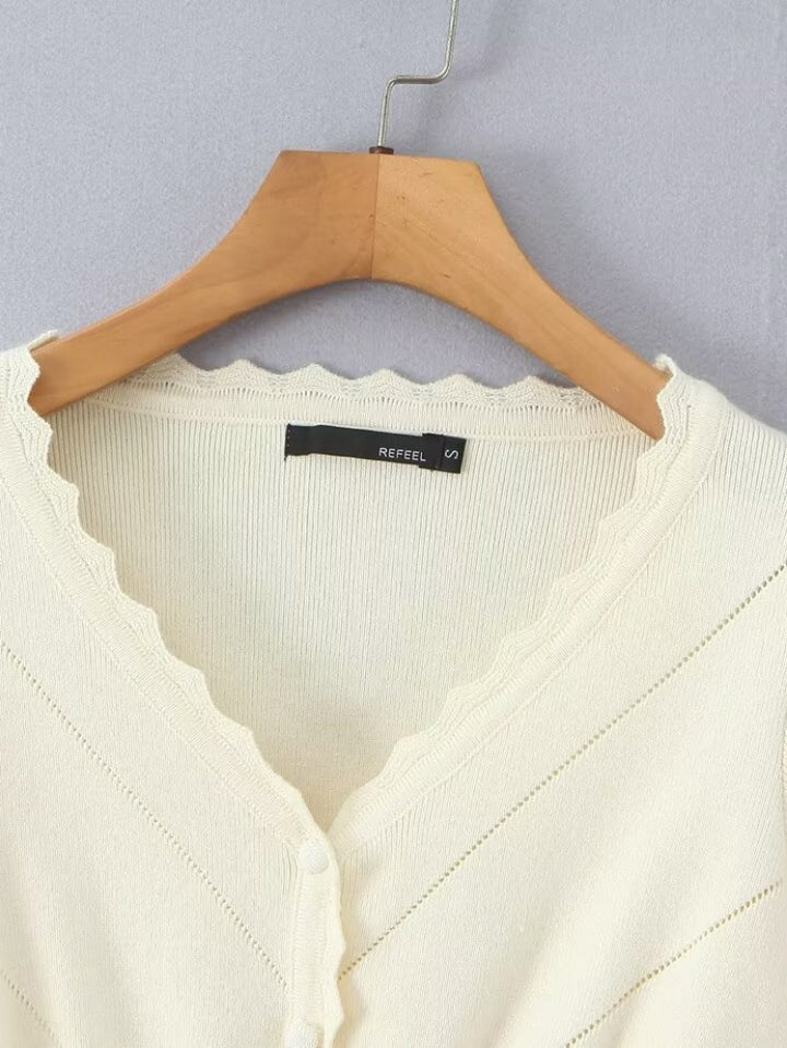 Short sleeve knitted jacket for women with ruffle details and button closure Lune London