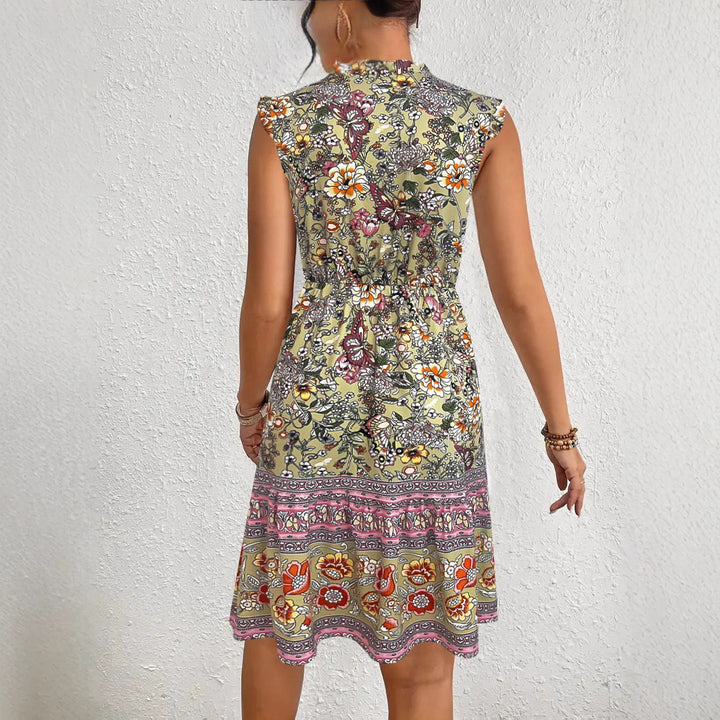 Summer midi dress for women with a playful floral pattern and a relaxed fit Lune London