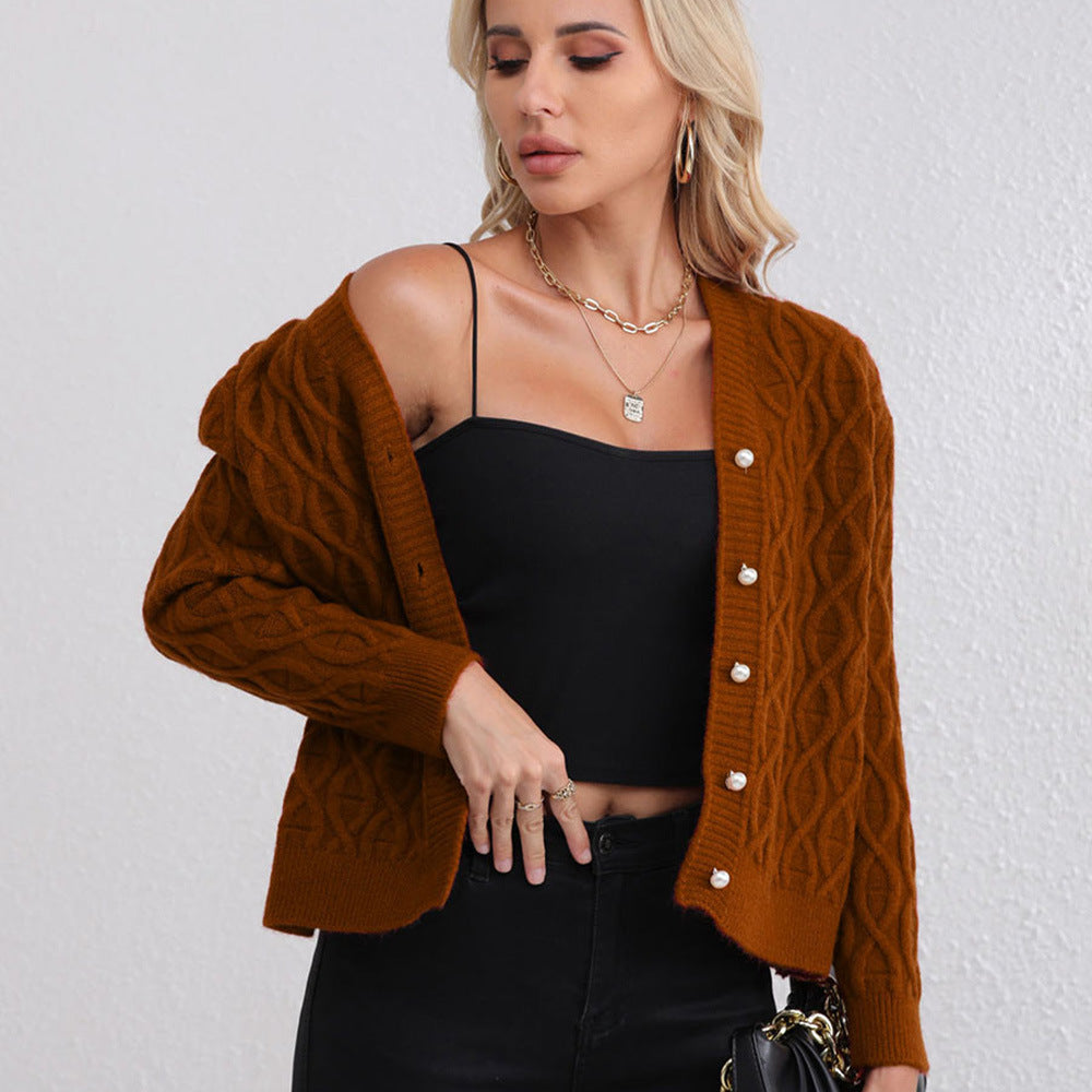 Women's knit jacket with modern cable pattern and pastel button details Lune London