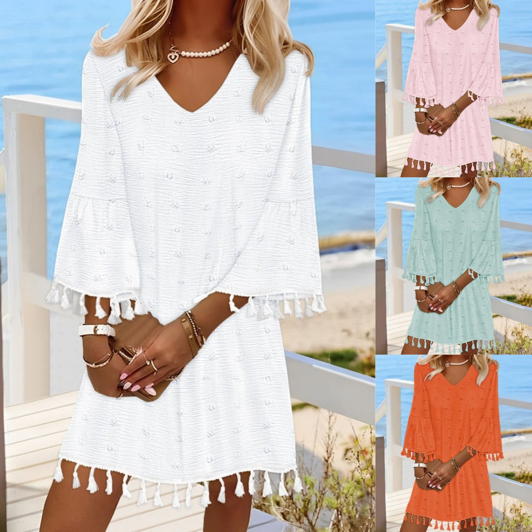 Beach dress for women with an elegant V-neckline and decorative fringes Lune London