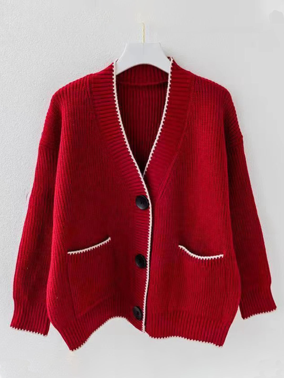 Ladies thick knit cardigan with deep V-neck and practical pockets Lune London