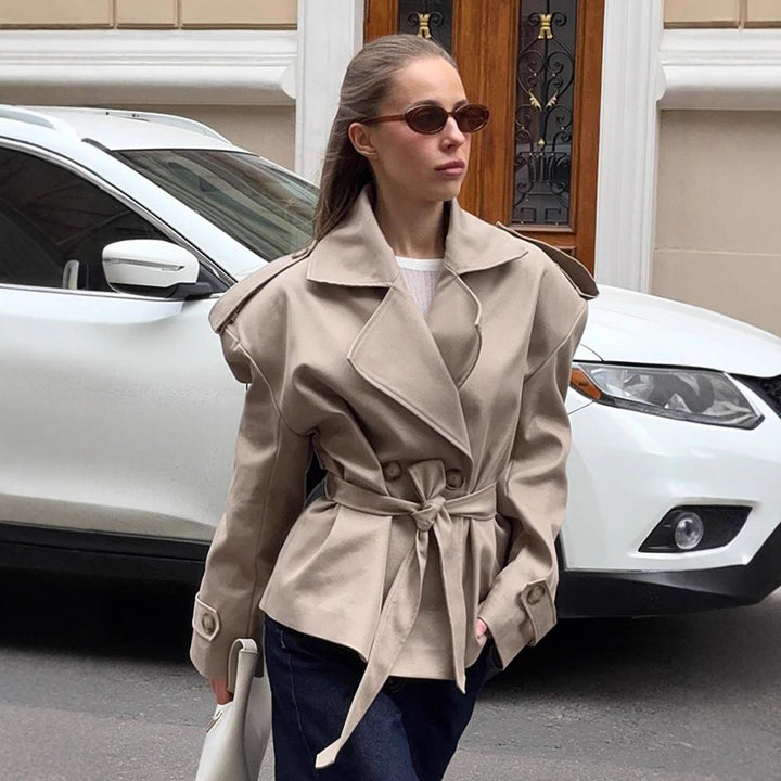 Elegant trench coat for women with fitted belt and bare shoulders Lune London