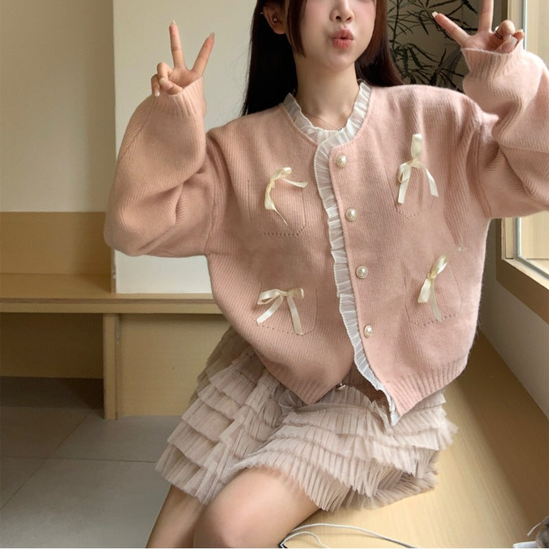 Knitted ladies' jacket with playful knots and pearl buttons Lune London