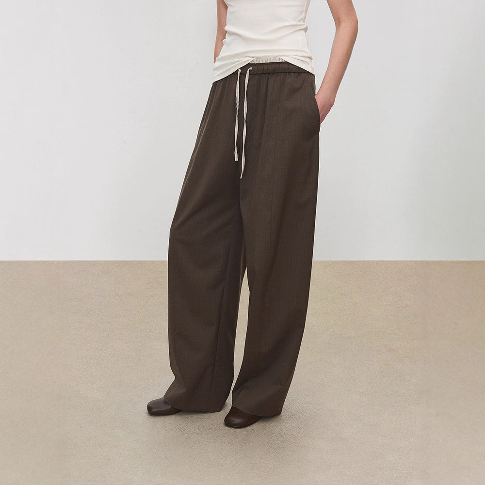 Pantalons en tissu large pour femmes avec taille élastique et poches pratiques Chic & Stil