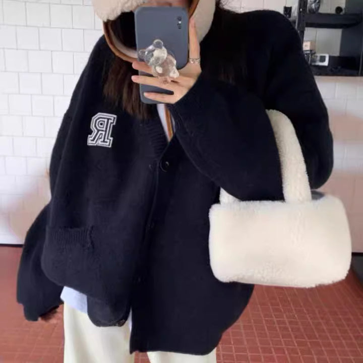 Casual knitted jacket for women with front pockets and button closure Lune London