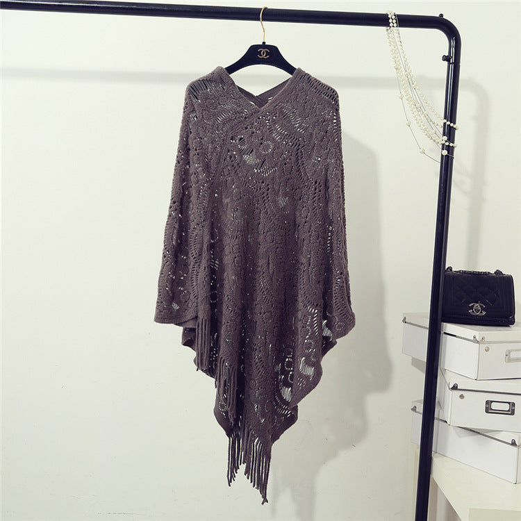 Knit poncho for women with an eye-catching crochet pattern and fashionable fringes Lune London
