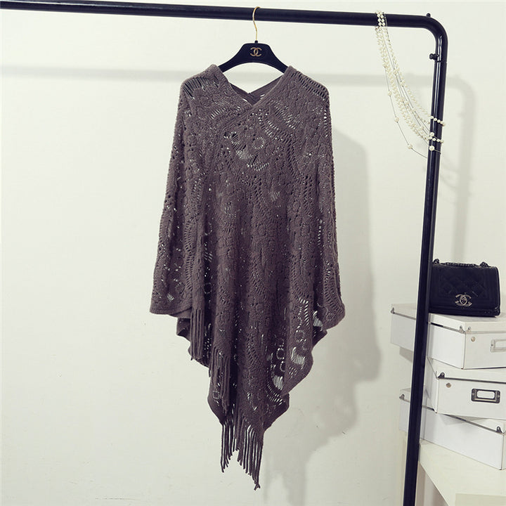 Knit poncho for women with an eye-catching crochet pattern and fashionable fringes Lune London