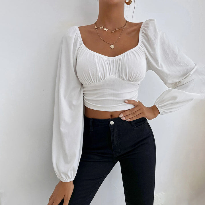 Chic & Stil Elegant puff sleeve design women's crop top with fitted silhouette