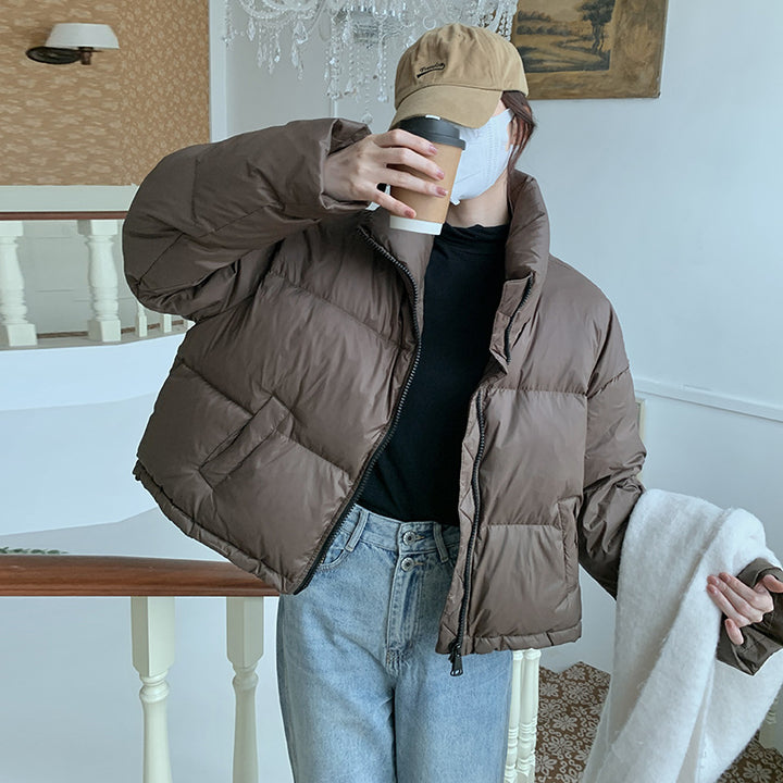 Short puffer jacket for women with high collar and side pockets Lune London