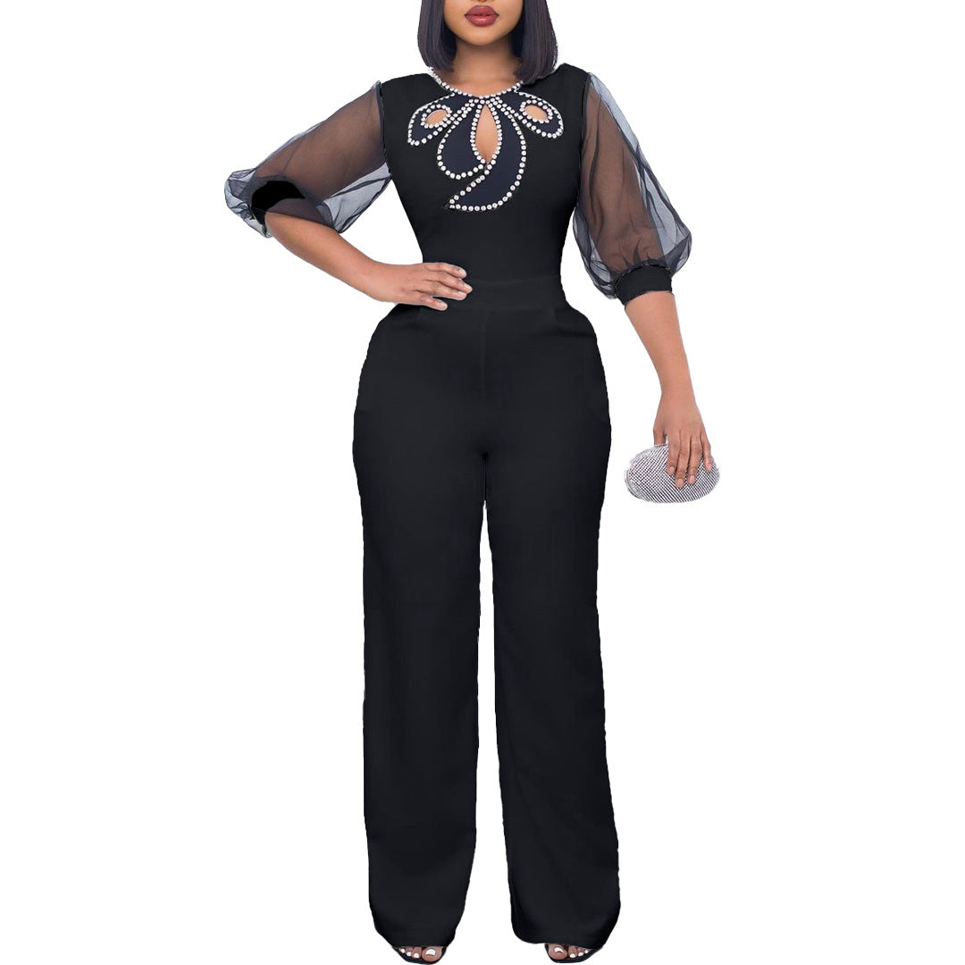 Elegant woman’s jumpsuit with sheer sleeves and pearl embellishment Lune London
