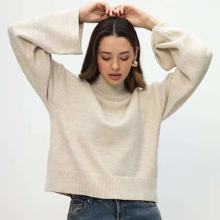 Trendy oversized knit sweater for women with wide sleeves and a high collar Lune London