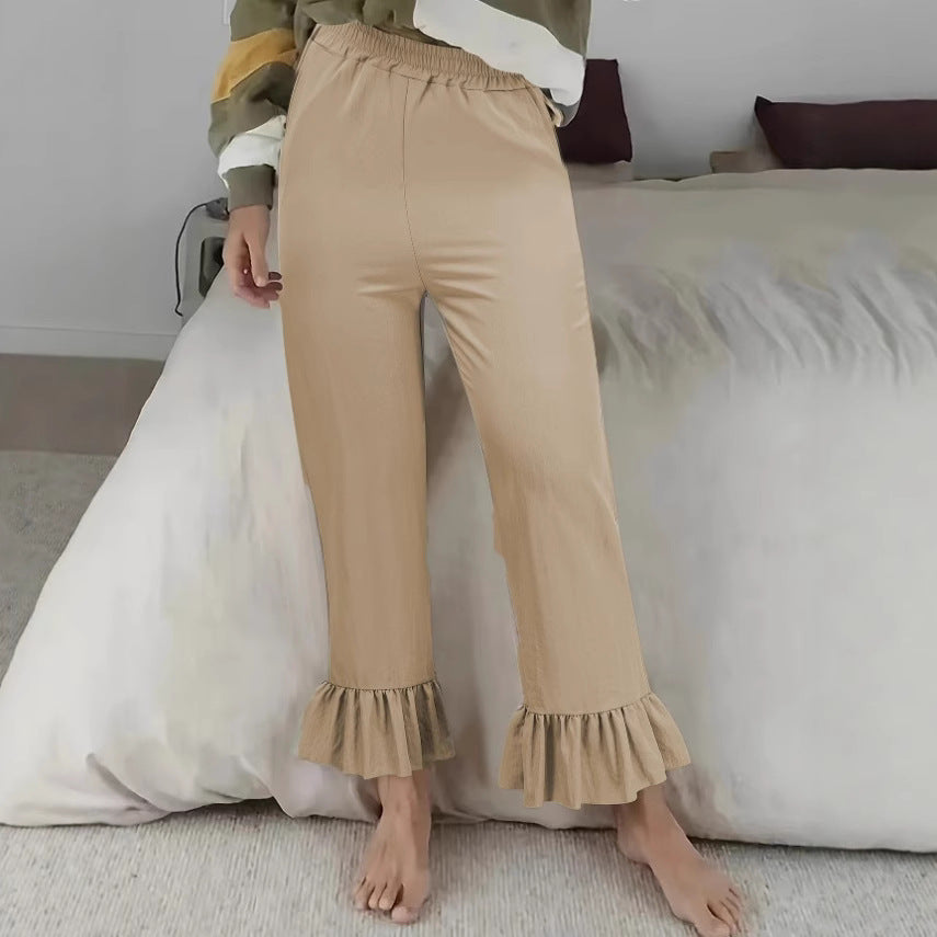 Women's flared pants with playful ruffle details Lune London