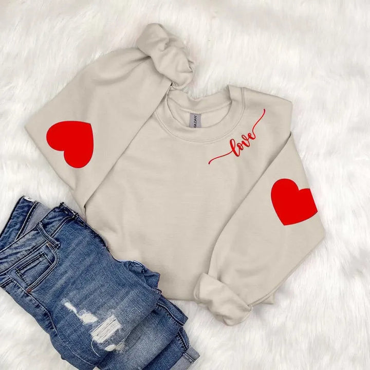 Sweatshirt femme avec design cœur et coupe décontractée Chic & Stil