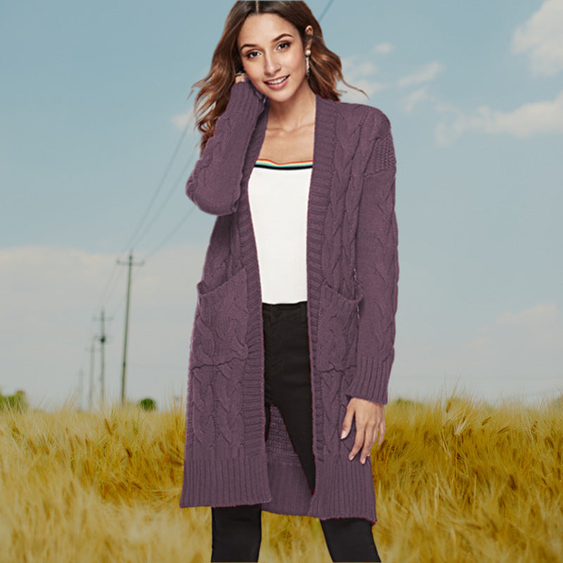Chunky knit cardigan for women with an elegant cable design and practical pockets Lune London
