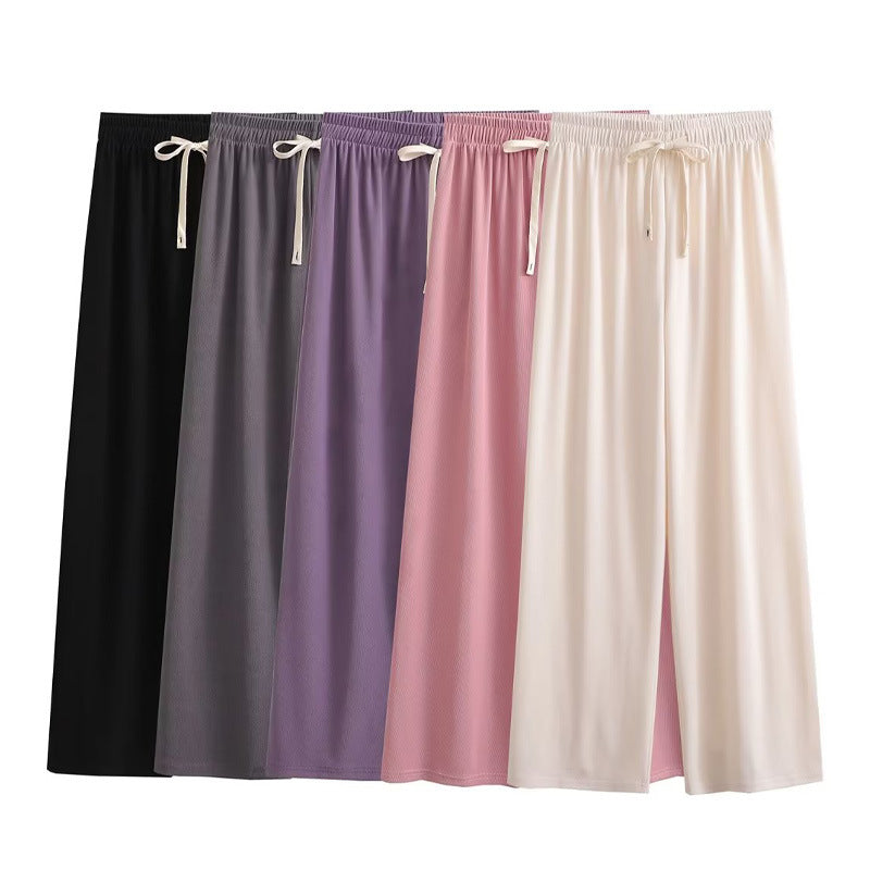 Wide palazzo pants for ladies with elastic waistband and decorative cord Lune London