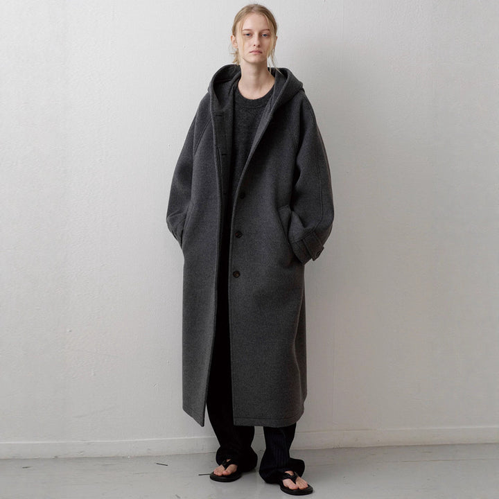 Manteau surdimensionné élégant pour femmes avec capuche et poches pratiques Chic & Stil