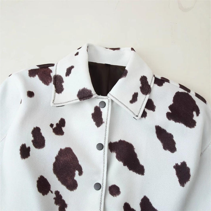 Women's leather jacket with trendy cow spot design and elegant button list Lune London